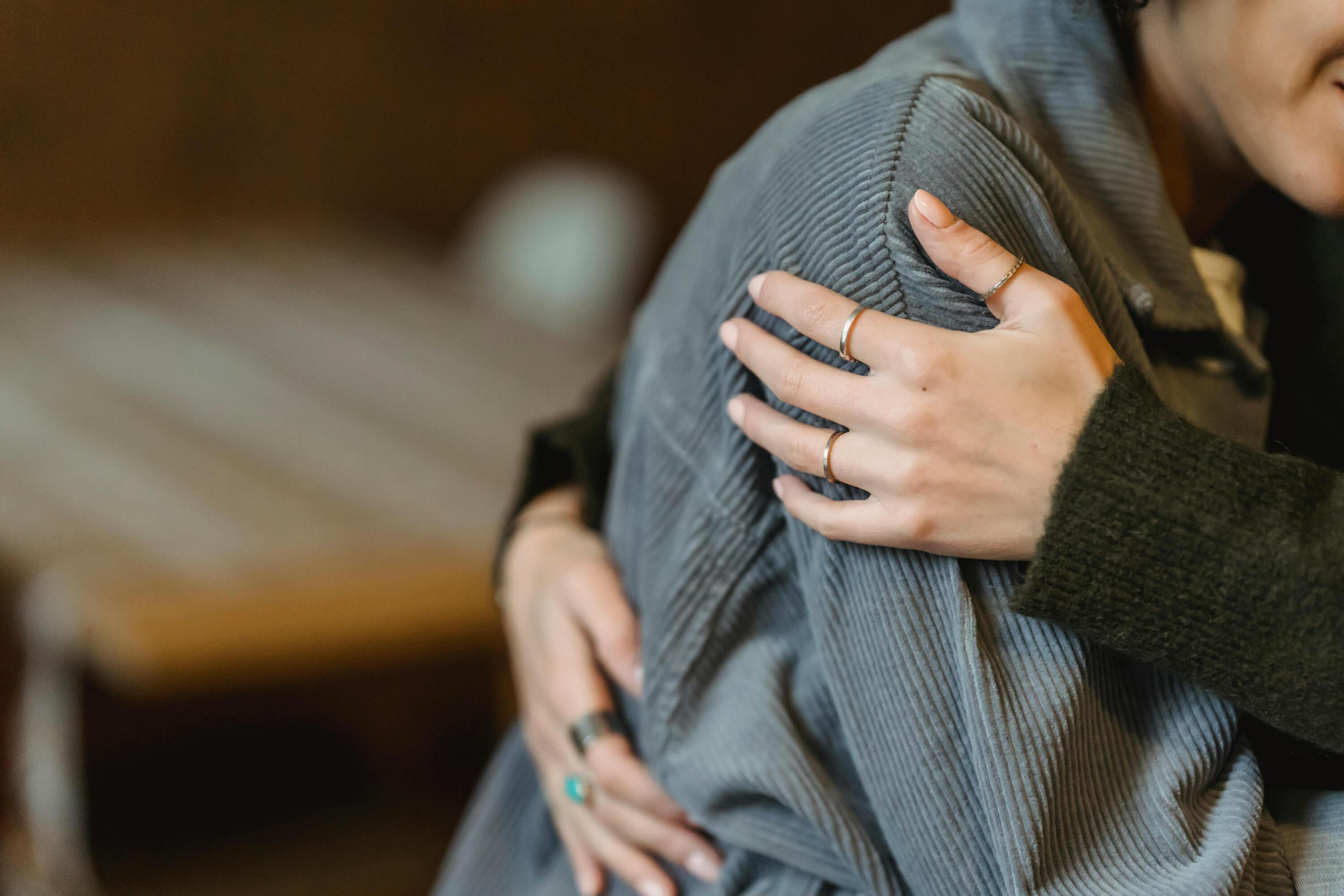 hugged-person-in-grey-blouse.jpg
