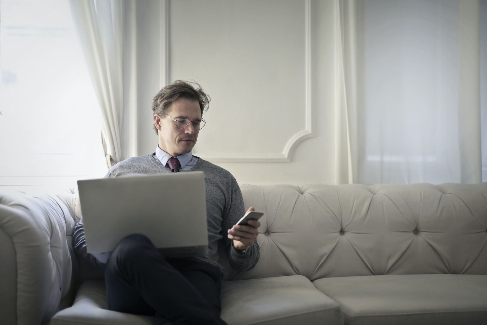 man-sitting-with-laptop-and-phone.jpg